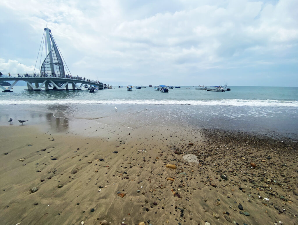 Puerto Vallarta pier and beach on cloudy day